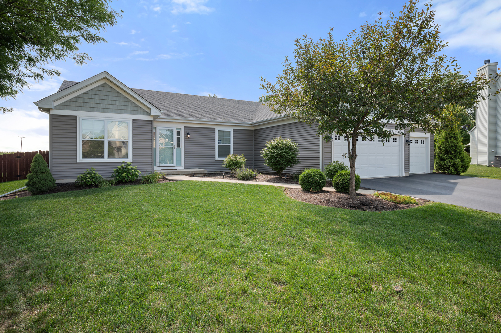 136 Reston Court Sycamore, IL 60178 - Photo 1 of 50 a front view of a house with garden