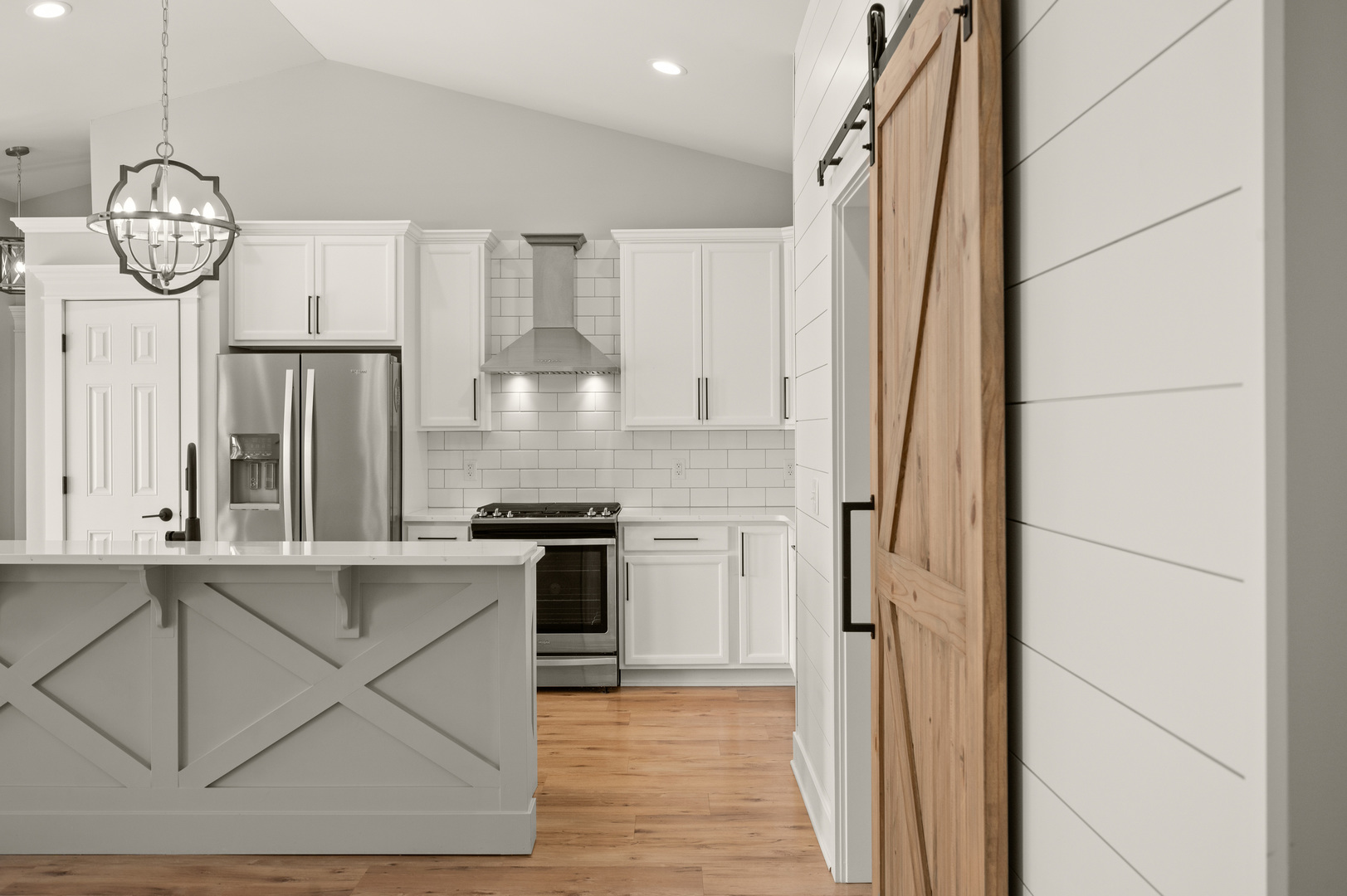 136 Reston Court Sycamore, IL 60178 - Photo 11 of 50 a view of a kitchen with wooden floor and a refrigerator