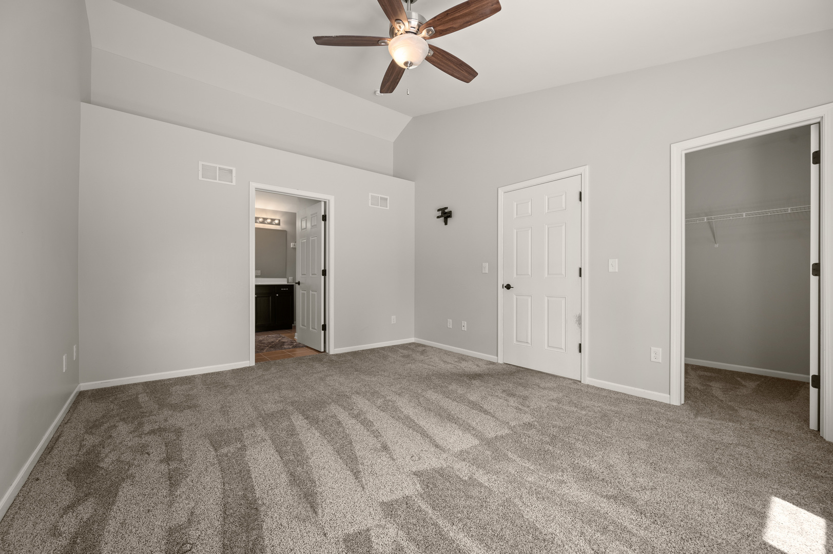 136 Reston Court Sycamore, IL 60178 - Photo 16 of 50 a view of an empty room with a ceiling fan