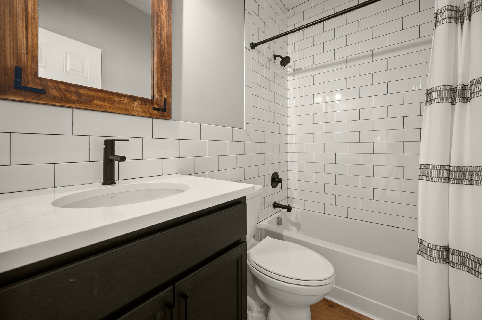 136 Reston Court Sycamore, IL 60178 - Photo 21 of 50 a bathroom with a sink a toilet and shower