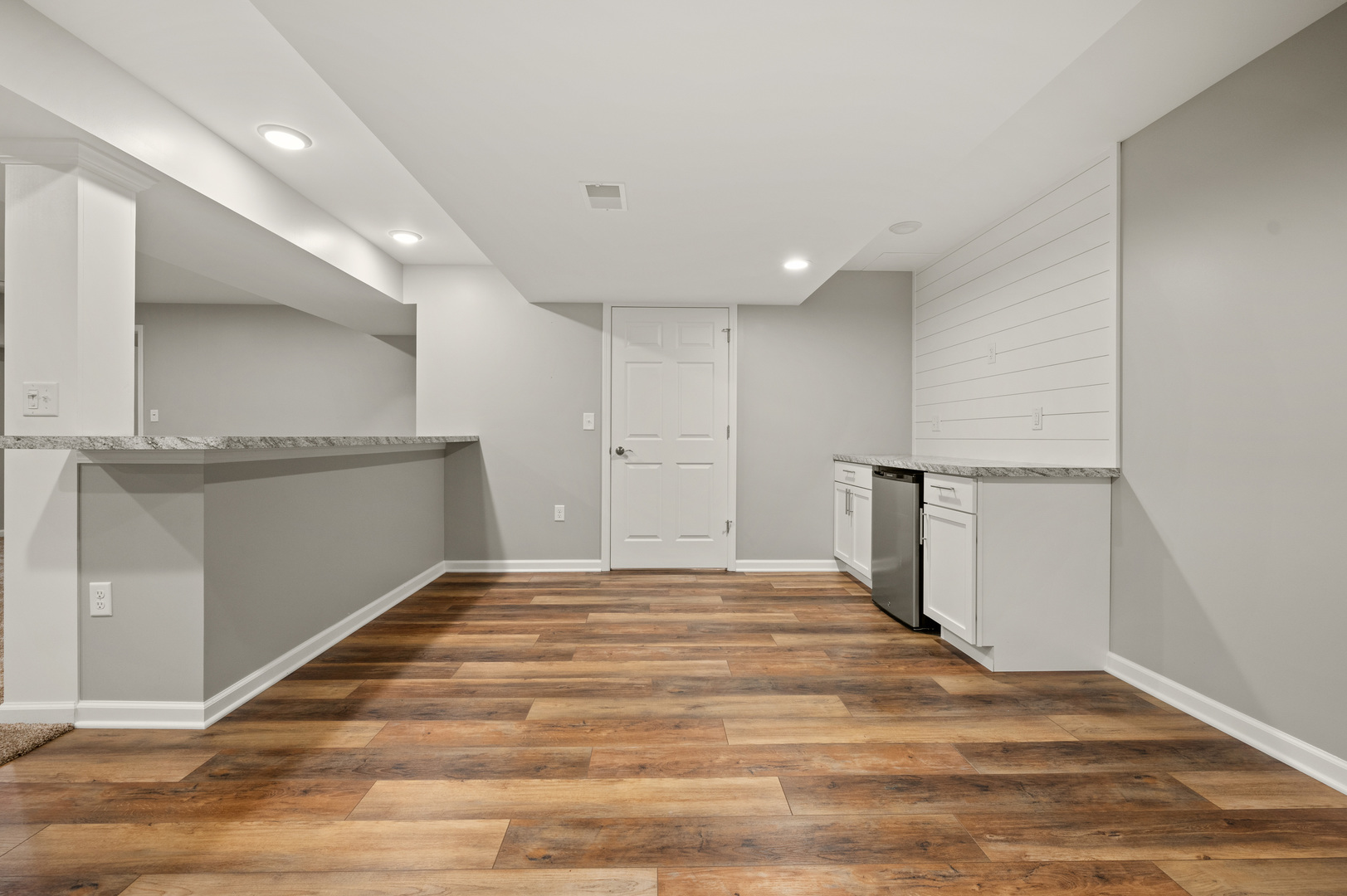 136 Reston Court Sycamore, IL 60178 - Photo 23 of 50 a view of an empty room with wooden floor