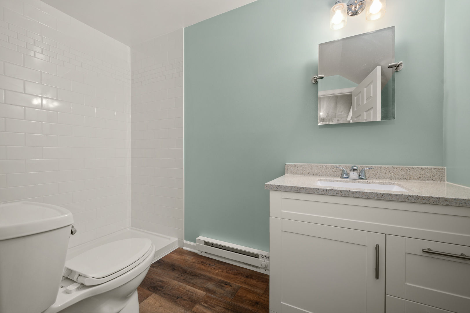 136 Reston Court Sycamore, IL 60178 - Photo 26 of 50 a bathroom with a granite countertop toilet sink and mirror