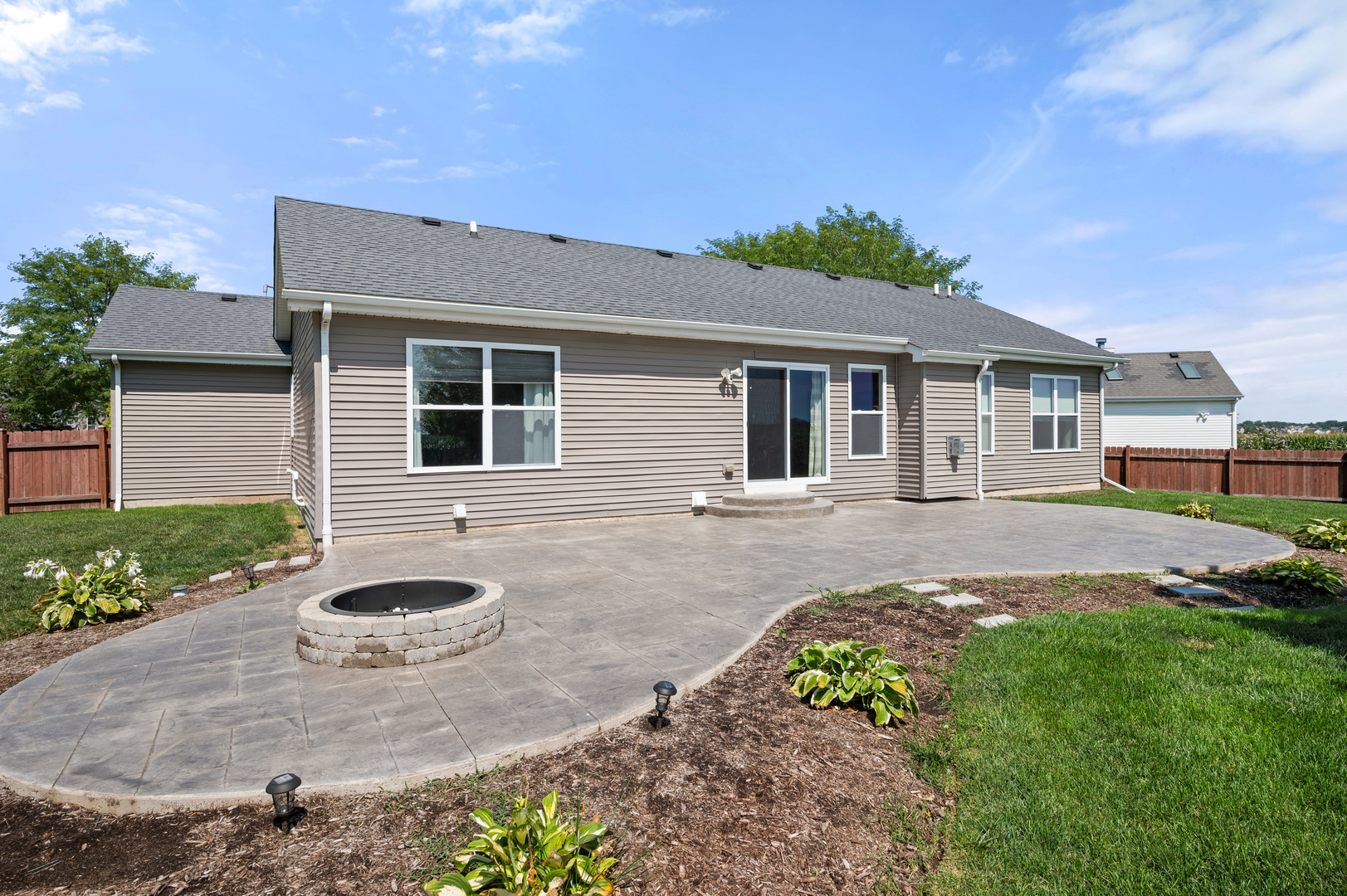 136 Reston Court Sycamore, IL 60178 - Photo 31 of 50 a front view of a house with garden