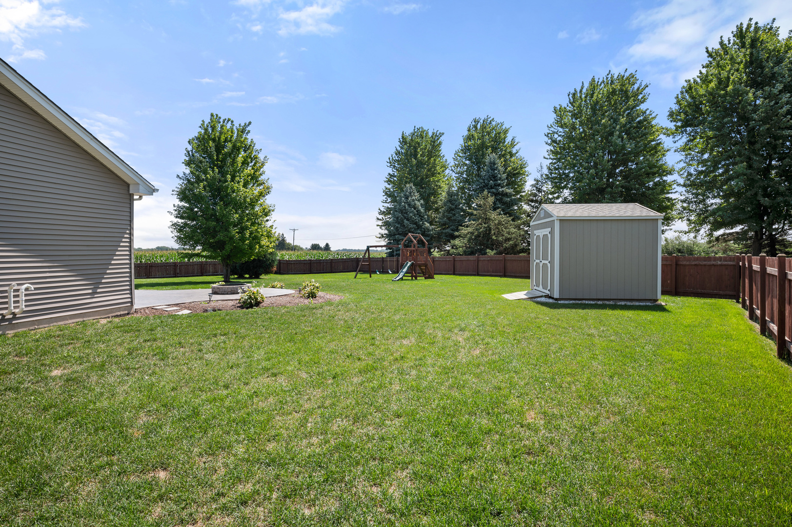 136 Reston Court Sycamore, IL 60178 - Photo 35 of 50 a view of a tiny house with a yard