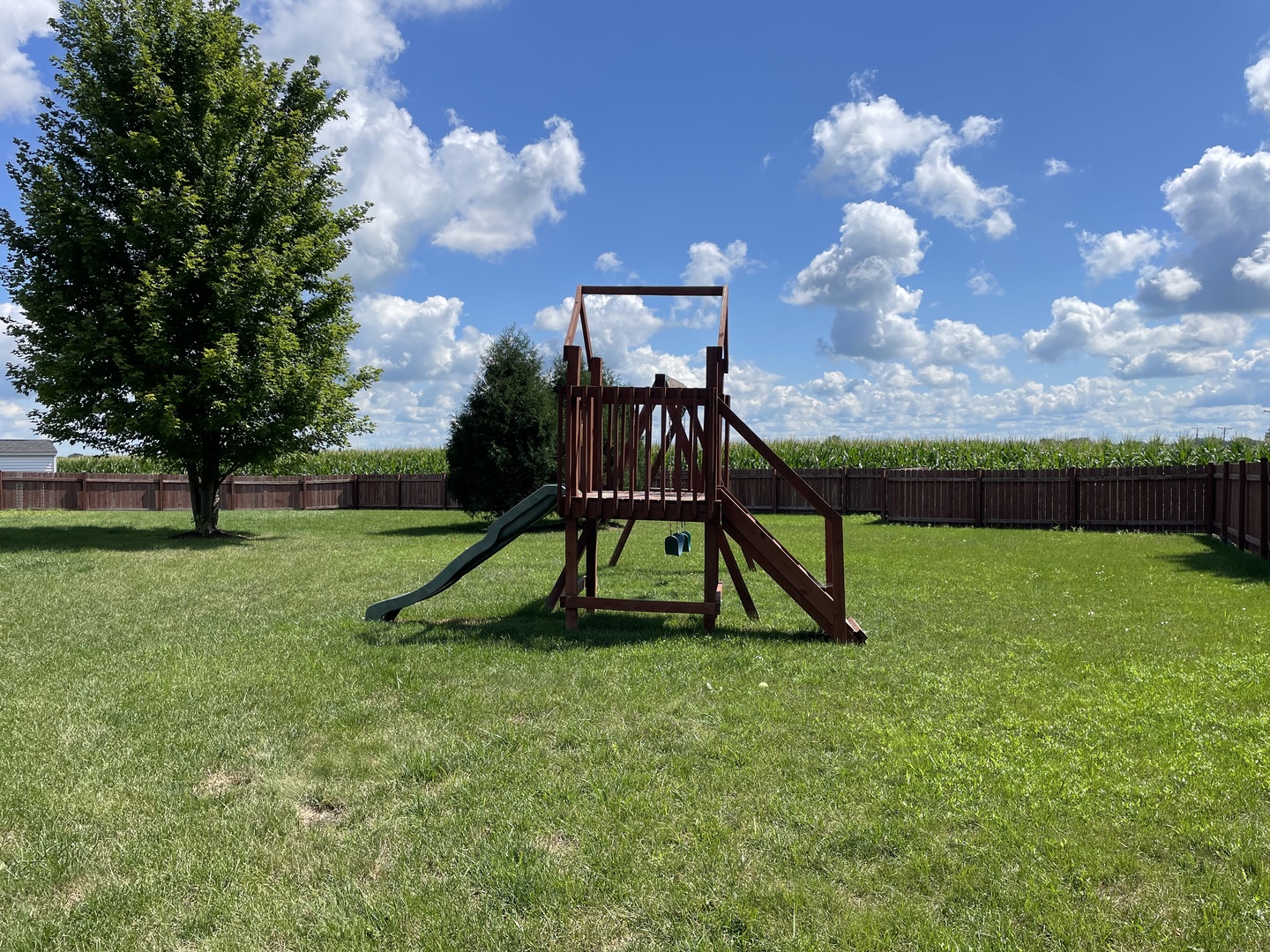 136 Reston Court Sycamore, IL 60178 - Photo 40 of 50 a view of a garden with a slide