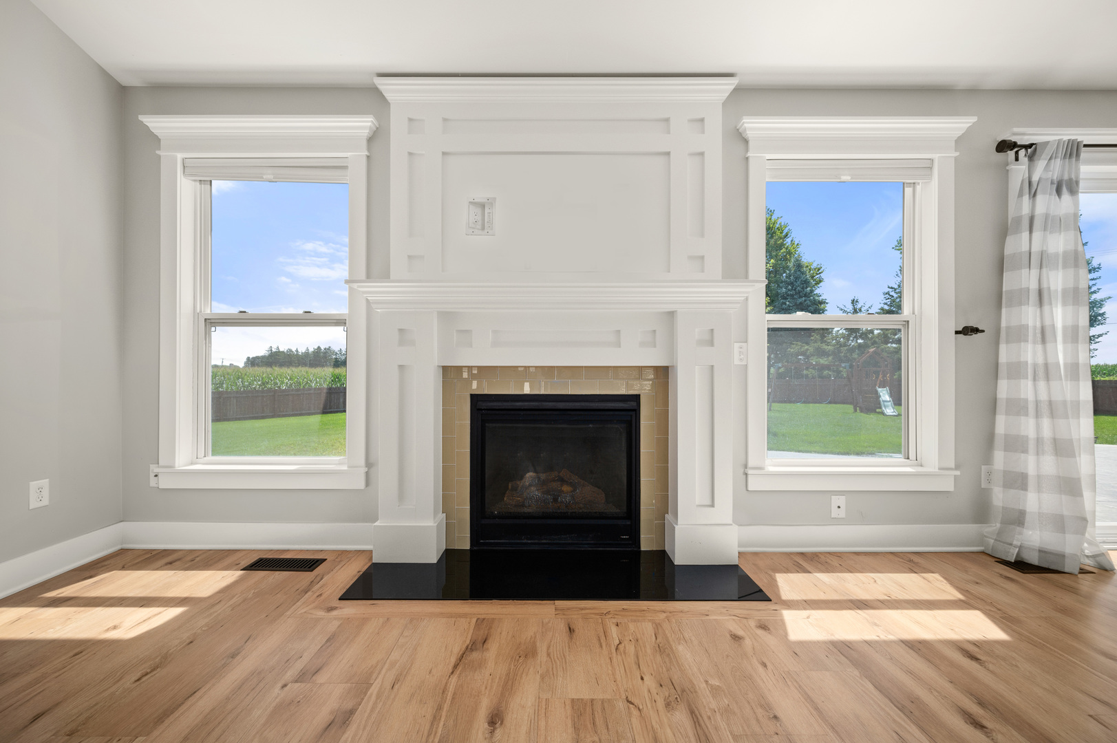 136 Reston Court Sycamore, IL 60178 - Photo 4 of 50 a living room with a fireplace and wooden floor