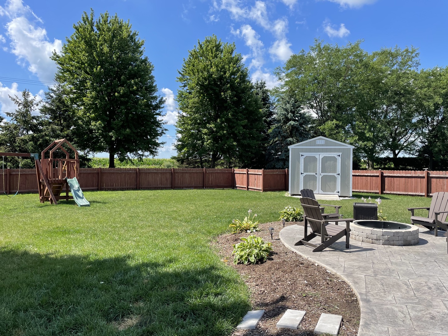 136 Reston Court Sycamore, IL 60178 - Photo 42 of 50 a view of a house with backyard and a slide