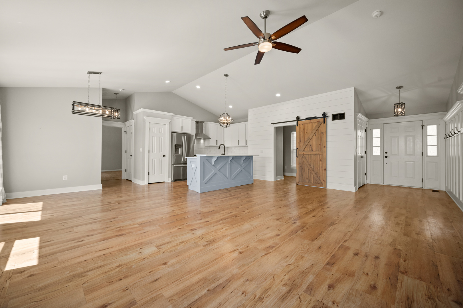136 Reston Court Sycamore, IL 60178 - Photo 5 of 50 a view of a livingroom with a kitchen and wooden floor