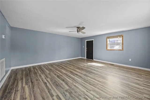 a kitchen with granite countertop a stove and a refrigerator
