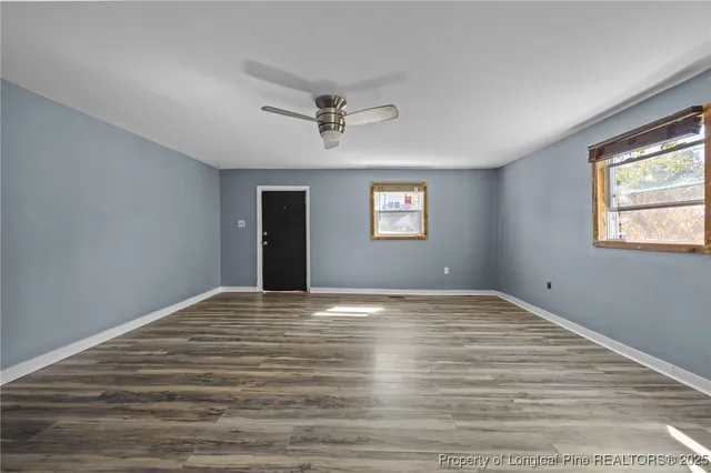a kitchen with stove cabinets and window