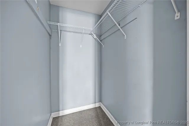 a bathroom with a sink a toilet and a window