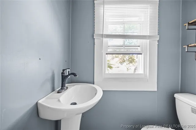 a view of a house with a tree beside it