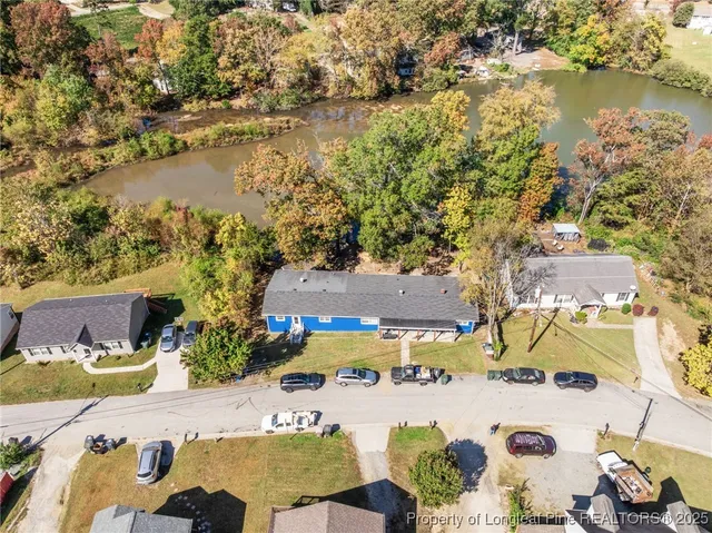 a view of house with outdoor space and swimming pool