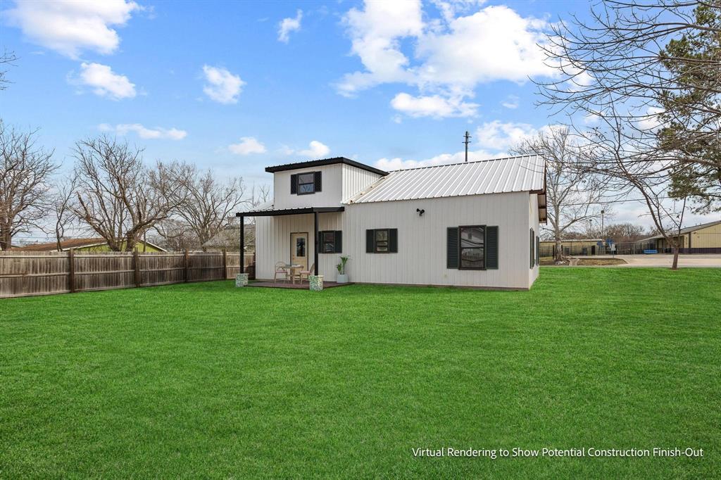 204 South Main Street Ector, TX 75439 - Photo 4 of 18 a view of a yard in front of a house