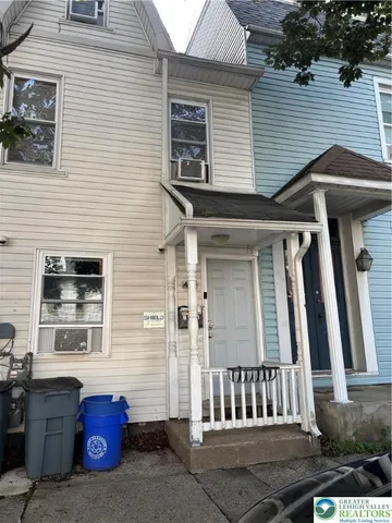 a kitchen with granite countertop stainless steel appliances a sink and a counter space