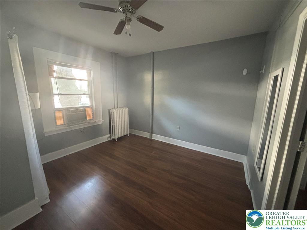 417 McCartney Street, Unit 1 Easton, PA 18042 - Photo 4 of 5 an empty room with wooden floor and windows