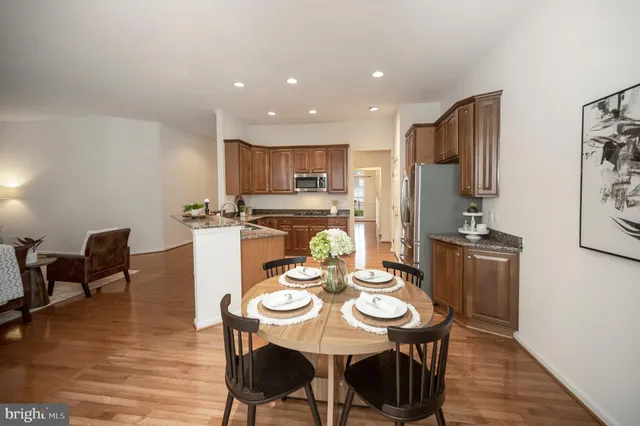 a bedroom with a bed and a potted plant