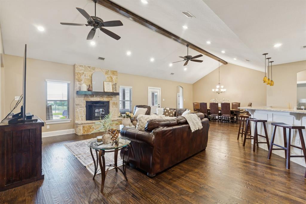 320 Tate Circle Sherman, TX 75090 - Photo 12 of 40 a living room with furniture kitchen view and a fireplace