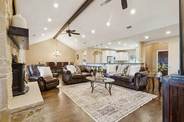 a living room with furniture and a rug