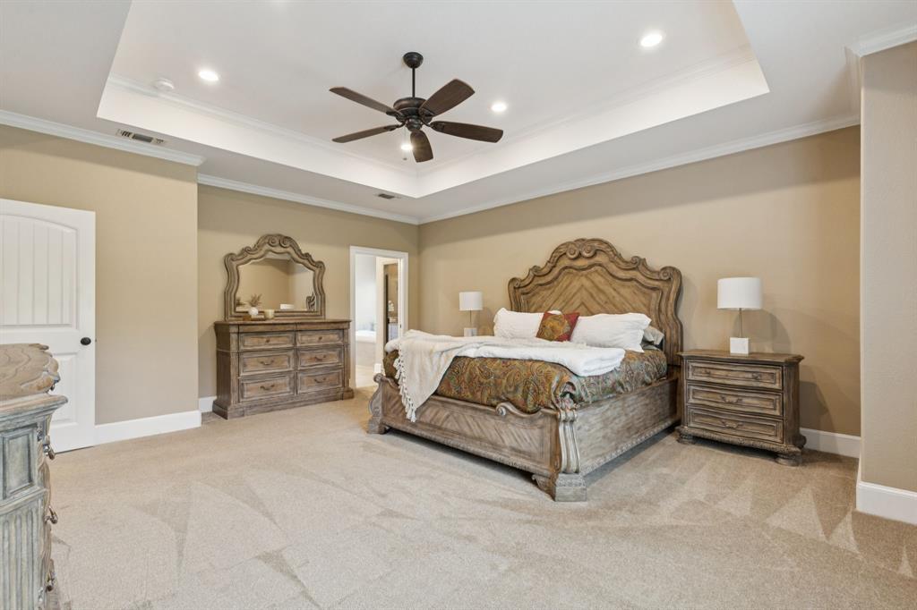 320 Tate Circle Sherman, TX 75090 - Photo 20 of 40 a bedroom with a bed and dresser