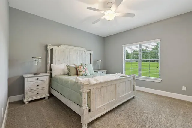 a bed room with a bed and a window