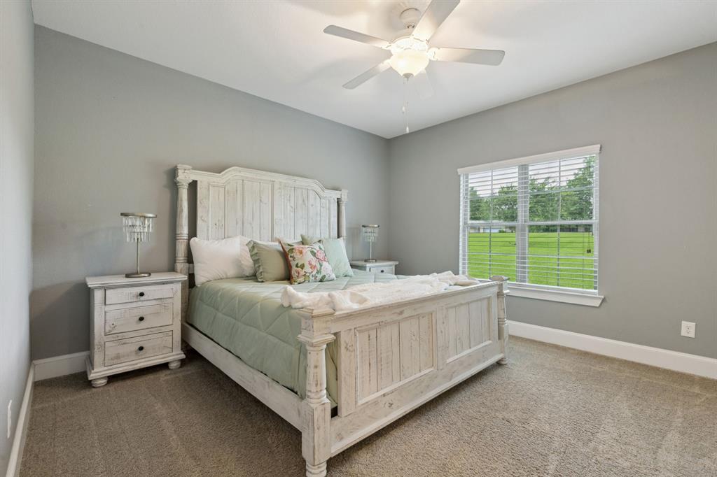 320 Tate Circle Sherman, TX 75090 - Photo 26 of 40 a bed room with a bed and a window