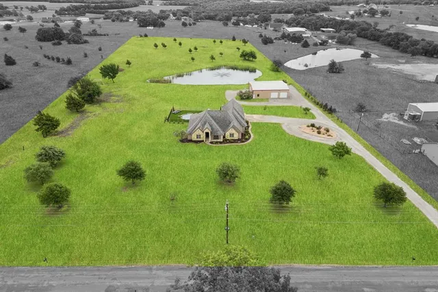 a view of a swimming pool with a yard