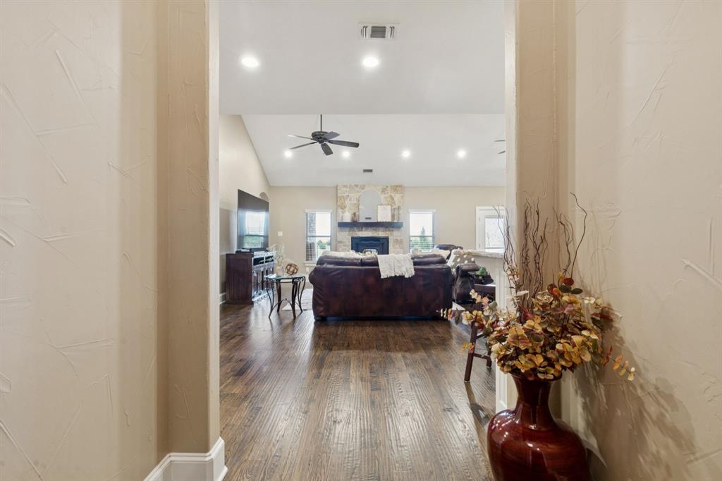 320 Tate Circle Sherman, TX 75090 - Photo 9 of 40 a living room with furniture and a chandelier