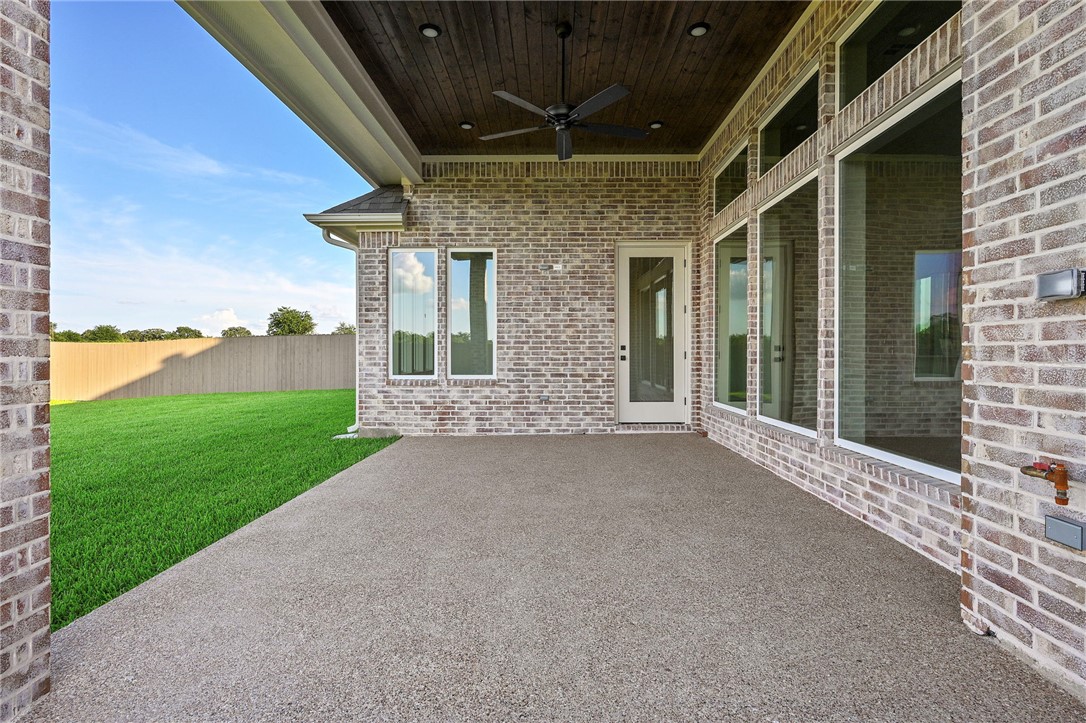 7052 Skipping Rock Path Bryan, TX 77808 - Photo 22 of 23 a view of a house with backyard and porch