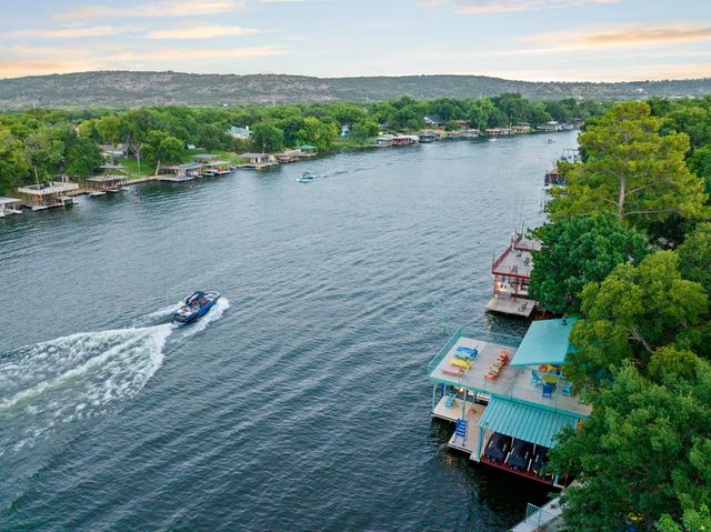 an aerial view of a house with a lake view
