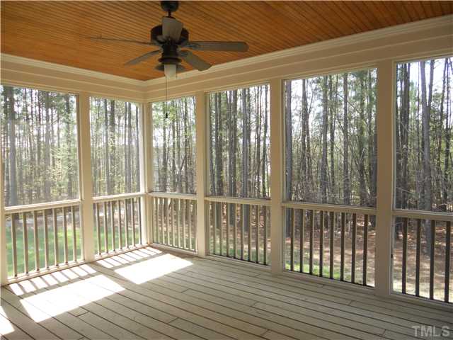 94 Winding Ridge Road Durham, NC 27713 - Photo 11 of 12 a view of a room with wooden floor and windows