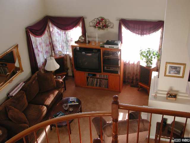 7577 Whimbleton Way Reno, NV 89511 - Photo 2 of 9 a view of a livingroom with furniture and a flat screen tv
