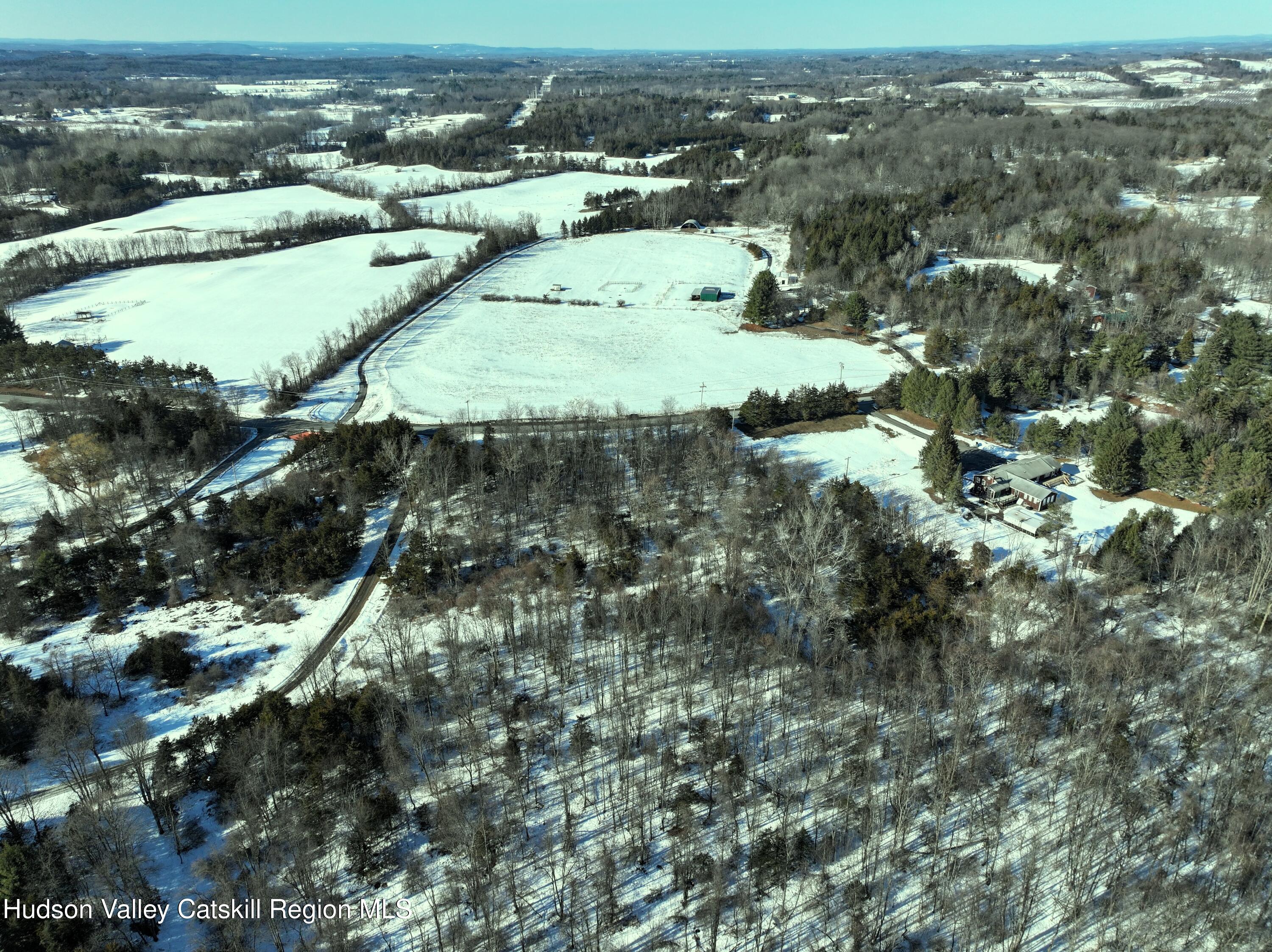 0 Bells Pond Road Hudson, NY 12534 - Photo 5 of 13 an aerial view of residential houses with outdoor space and trees