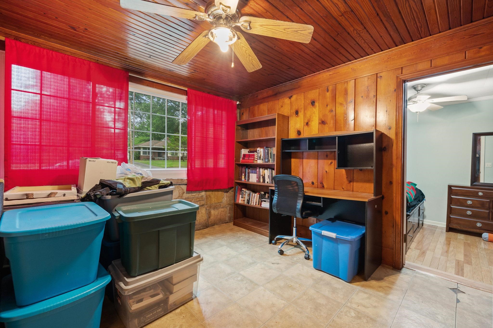 981 Tatum Road Memphis, TN 38122 - Photo 10 of 16 a room with furniture a flat screen tv and dresser