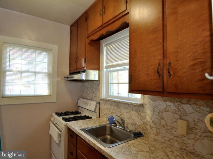204 Wampler Road Middle River, MD 21220 - Photo 1 of 22 a kitchen that has a sink and a stove