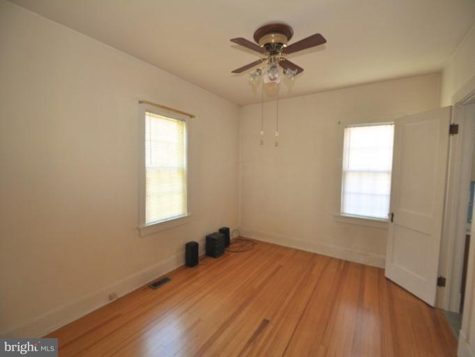 204 Wampler Road Middle River, MD 21220 - Photo 13 of 22 wooden floor in an empty room with a window