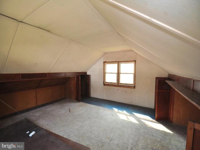 204 Wampler Road Middle River, MD 21220 - Photo 4 of 22 a view of an empty room with wooden floor and a window