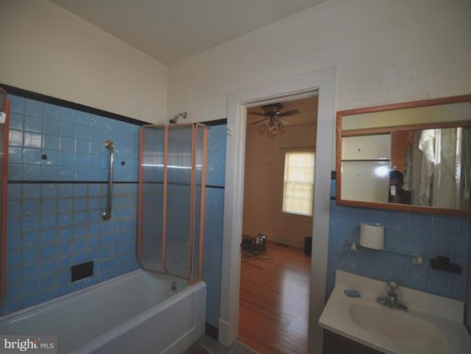 204 Wampler Road Middle River, MD 21220 - Photo 5 of 22 a bathroom with a tub shower vanity and a sink