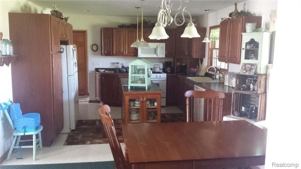 14289 Gilbert Road Allenton, MI 48002 - Photo 2 of 19 This is a view of the kitchen from the dining area.