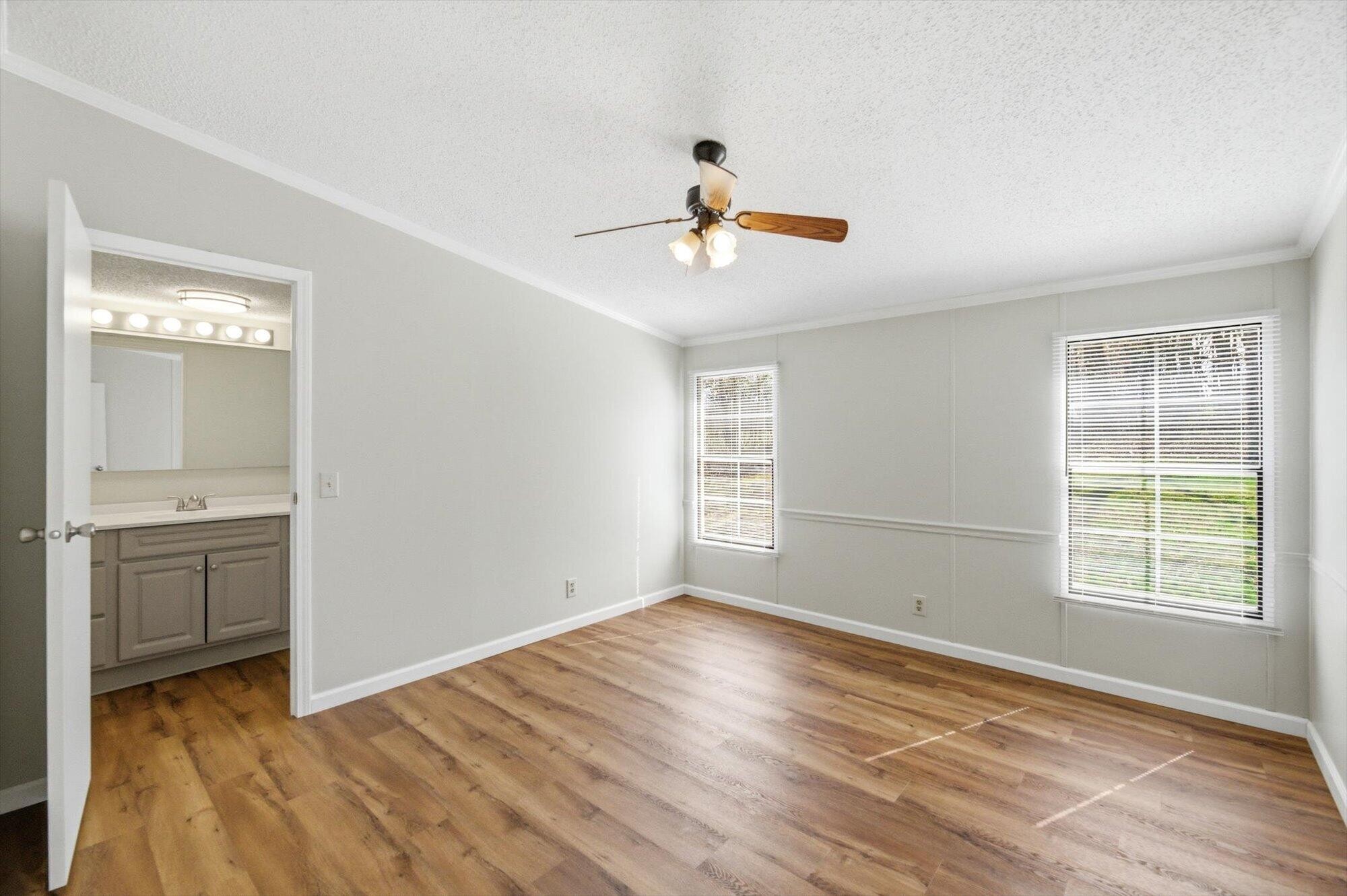 64 County Road 100 Decatur, TN 37322 - Photo 11 of 43 a view of an empty room with window and wooden floor