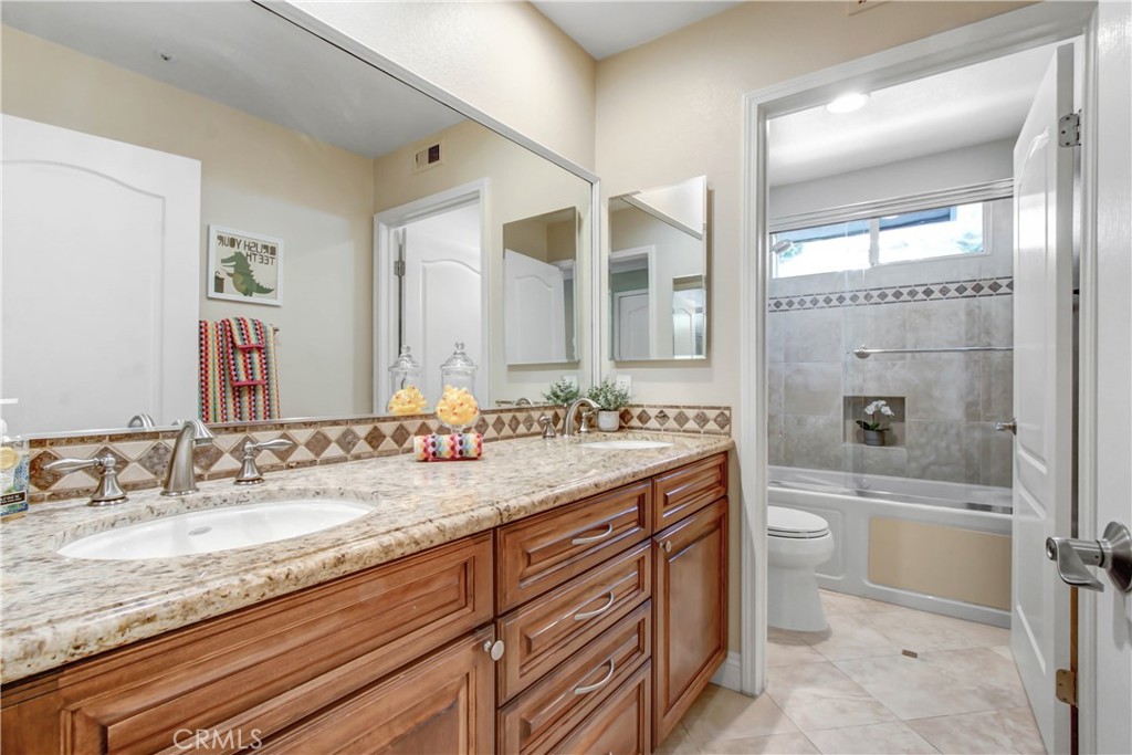 12036 Wood Ranch Road Granada Hills, CA 91344 - Photo 35 of 55 Upstairs Full Bath with double sinks and separate toilet & tub shower