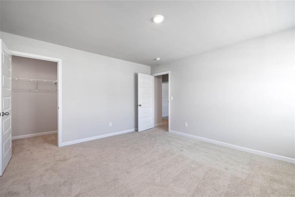 652 Whitman Lane Stockbridge, GA 30281 - Photo 19 of 36 an empty room with an entryway