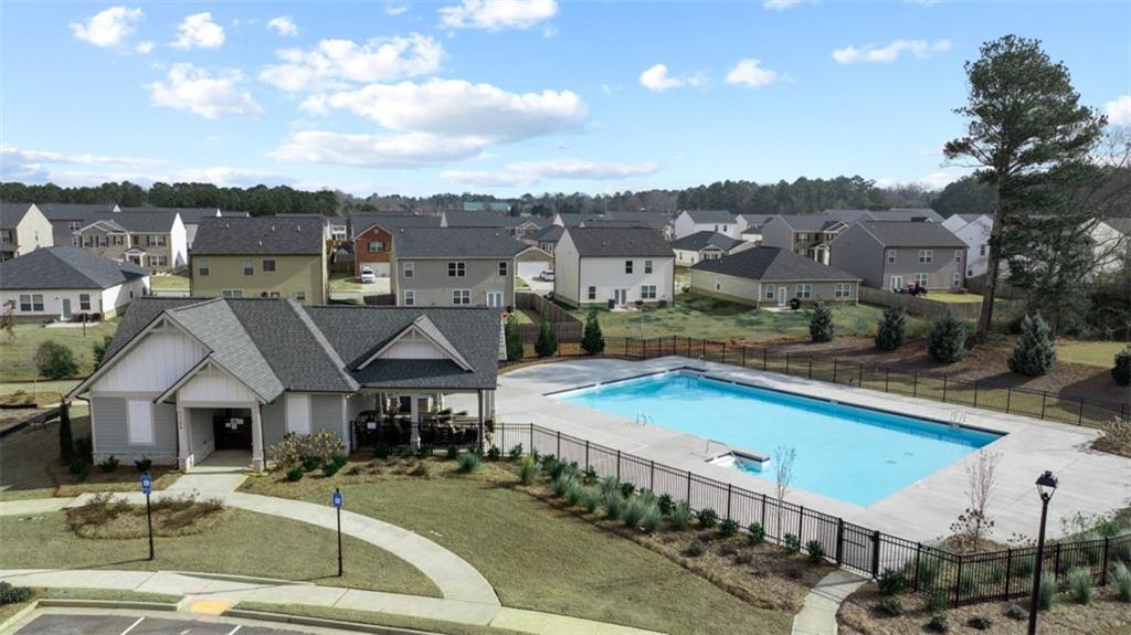 652 Whitman Lane Stockbridge, GA 30281 - Photo 2 of 36 a view of multiple houses with a swimming pool