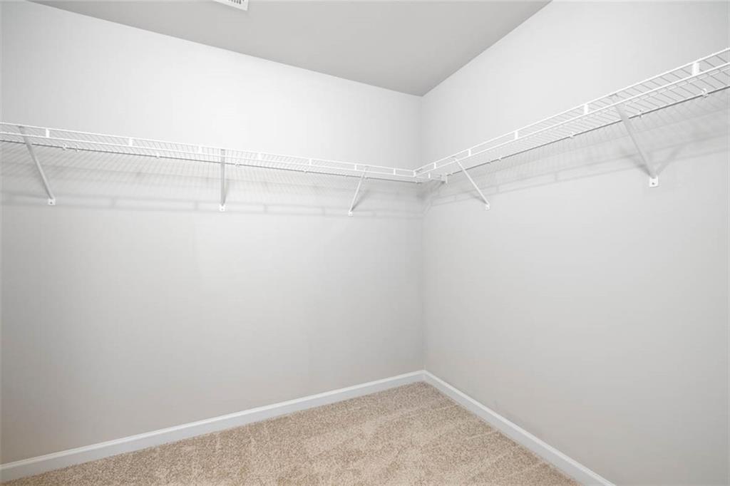 652 Whitman Lane Stockbridge, GA 30281 - Photo 22 of 36 a view of a room with racks on the wall