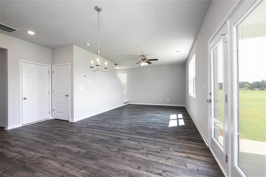 652 Whitman Lane Stockbridge, GA 30281 - Photo 29 of 36 a view of an empty room with wooden floor and a window