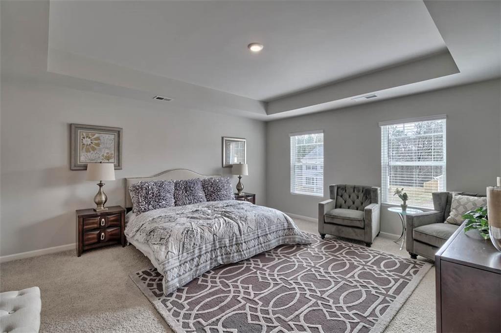 652 Whitman Lane Stockbridge, GA 30281 - Photo 34 of 36 a bedroom with double bed furniture and a window