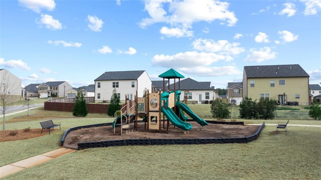 652 Whitman Lane Stockbridge, GA 30281 - Photo 4 of 36 a view of a park with swings and slides