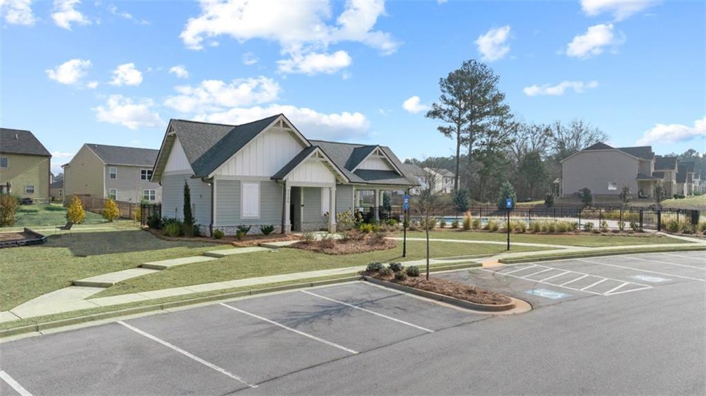 652 Whitman Lane Stockbridge, GA 30281 - Photo 5 of 36 a view of swimming pool with outdoor seating and trees in the background