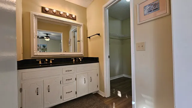 a view of a room with wooden floor and windows