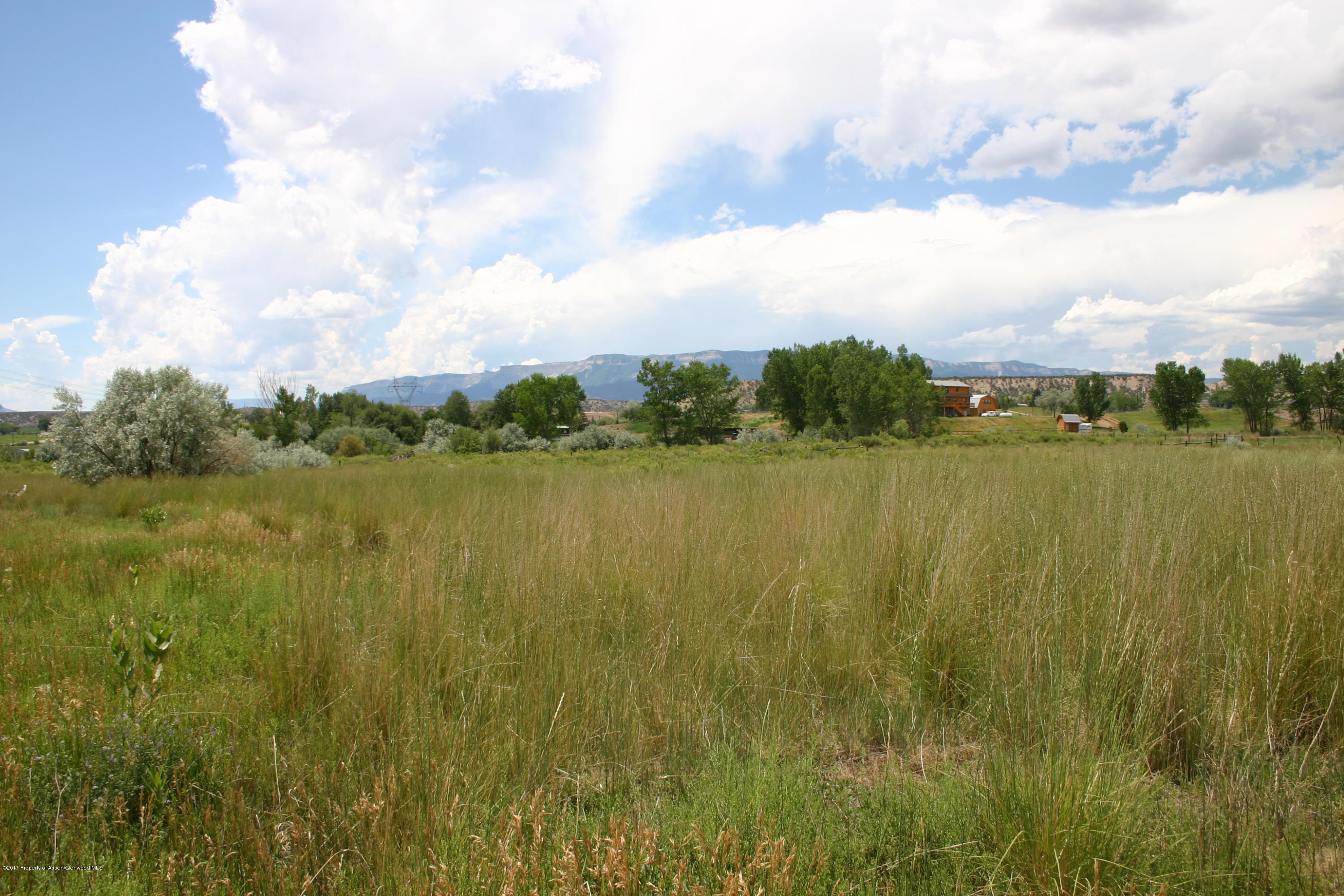 27 County Road 259 Rifle, CO 81650 - Photo 5 of 7 a view of a lake with houses in the back